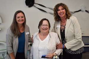 Diana Brown posts with two other women at Curative Connections